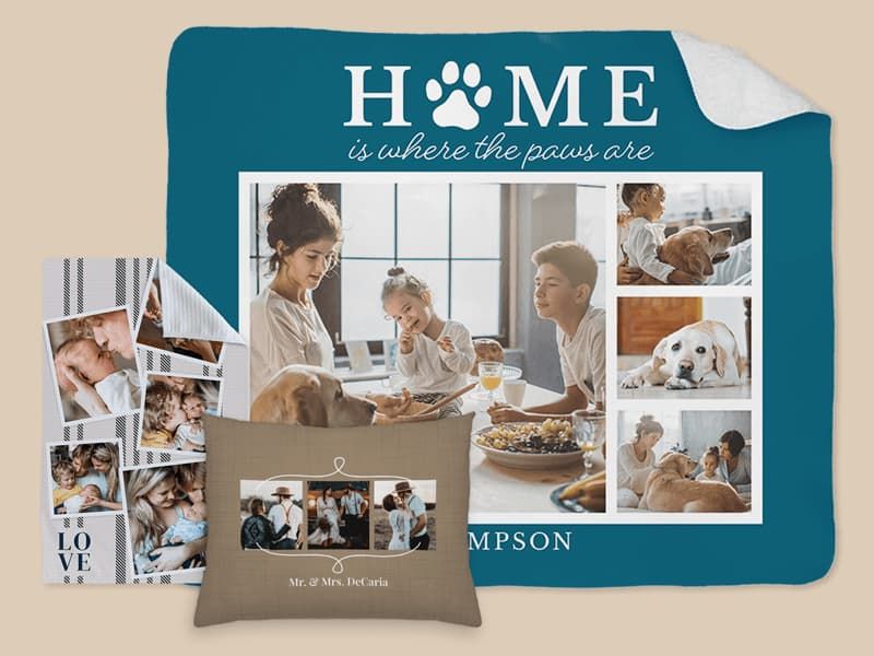 Personalized home decor items: a large teal 'Home is where the paws are' blanket with family and dog photos, a striped 'Love' photo poster of family moments, and a tan throw pillow with couple photos reading 'Mr. & Mrs. DeCaria'.